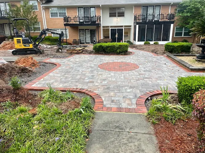Finished paver patio installation with brick borders