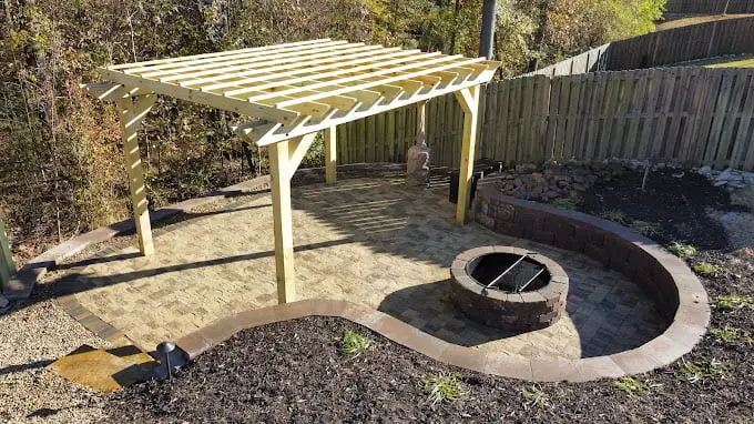 Patio with pergola and fire pit designed by Benson Lawn Maintenance